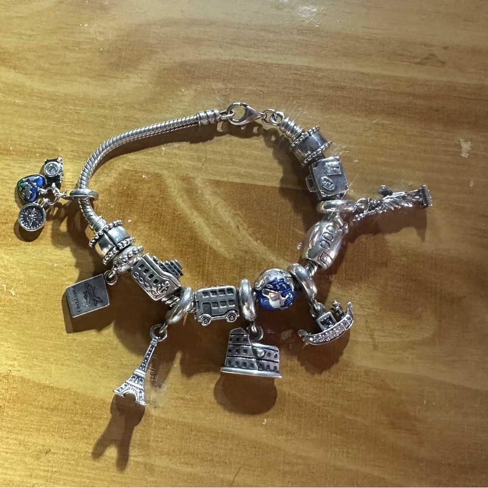 authentic Pandora Travelers charm bracelet. It’s a must have if u travel a-lot. - Picture 7 of 9